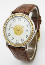 A FABULOUS HERMES OF PARIS GENTS WATCH WITH WHITE DIAL AND CIRCULAR CENTRAL LOGO ON A BROWN