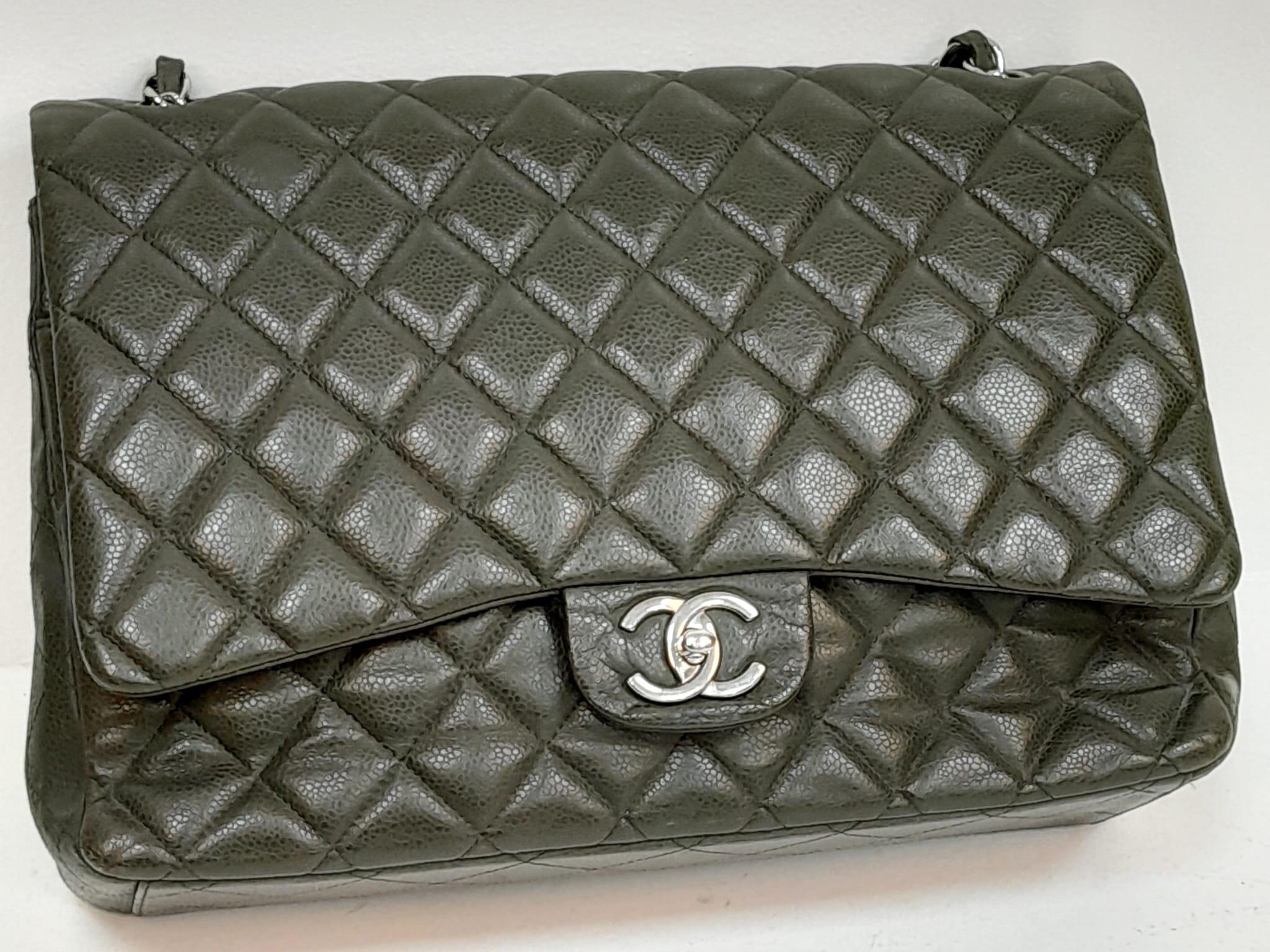 A Chanel Green Jumbo Classic Double Flap Bag. Quilted leather exterior with silver-toned hardware, - Image 4 of 14