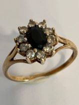 Attractive 9 carat GOLD DRESS RING, Having oval cut SPINEL to centre with clear ZIRCONIA surround.