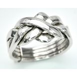 A 9K WHITE GOLD PUZZLE RING. 5.4G. SIZE N.