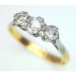 A VINTAGE 18K YELLOW GOLD, PLATINUM AND DIAMOND 3 STONE RING. 0.15CT. 2.2G. SIZE O