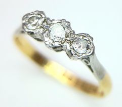 A VINTAGE 18K YELLOW GOLD, PLATINUM AND DIAMOND 3 STONE RING. 0.15CT. 2.2G. SIZE O