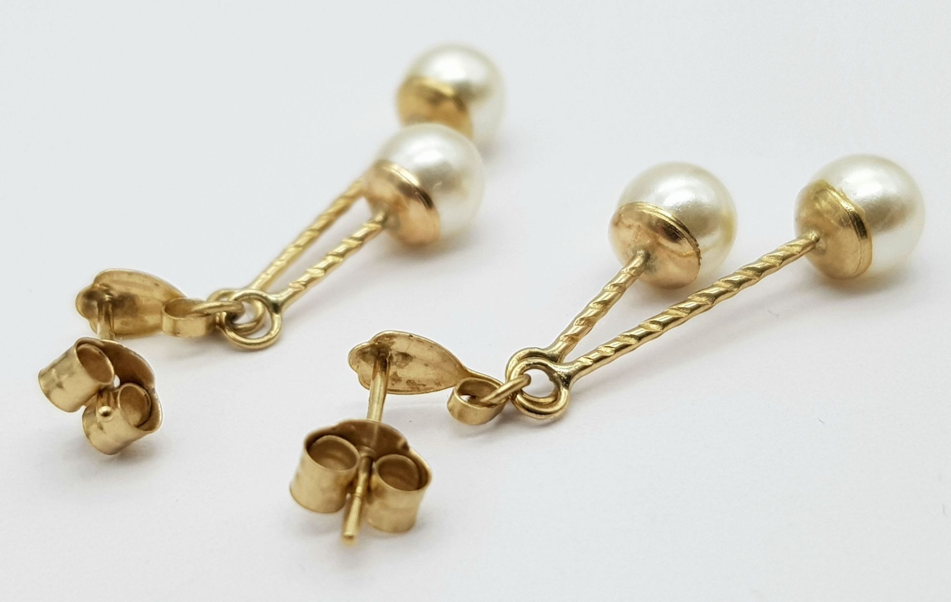 A 9ct Yellow Gold Double Drop Pearl Studs, 4mm pearl size, 0.9g weight, approx 2.5cm drop ref: - Image 3 of 4