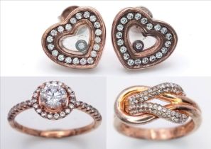 A sterling silver group of TWO rings and ONE pair of earrings, with rose gold vermeil finish and