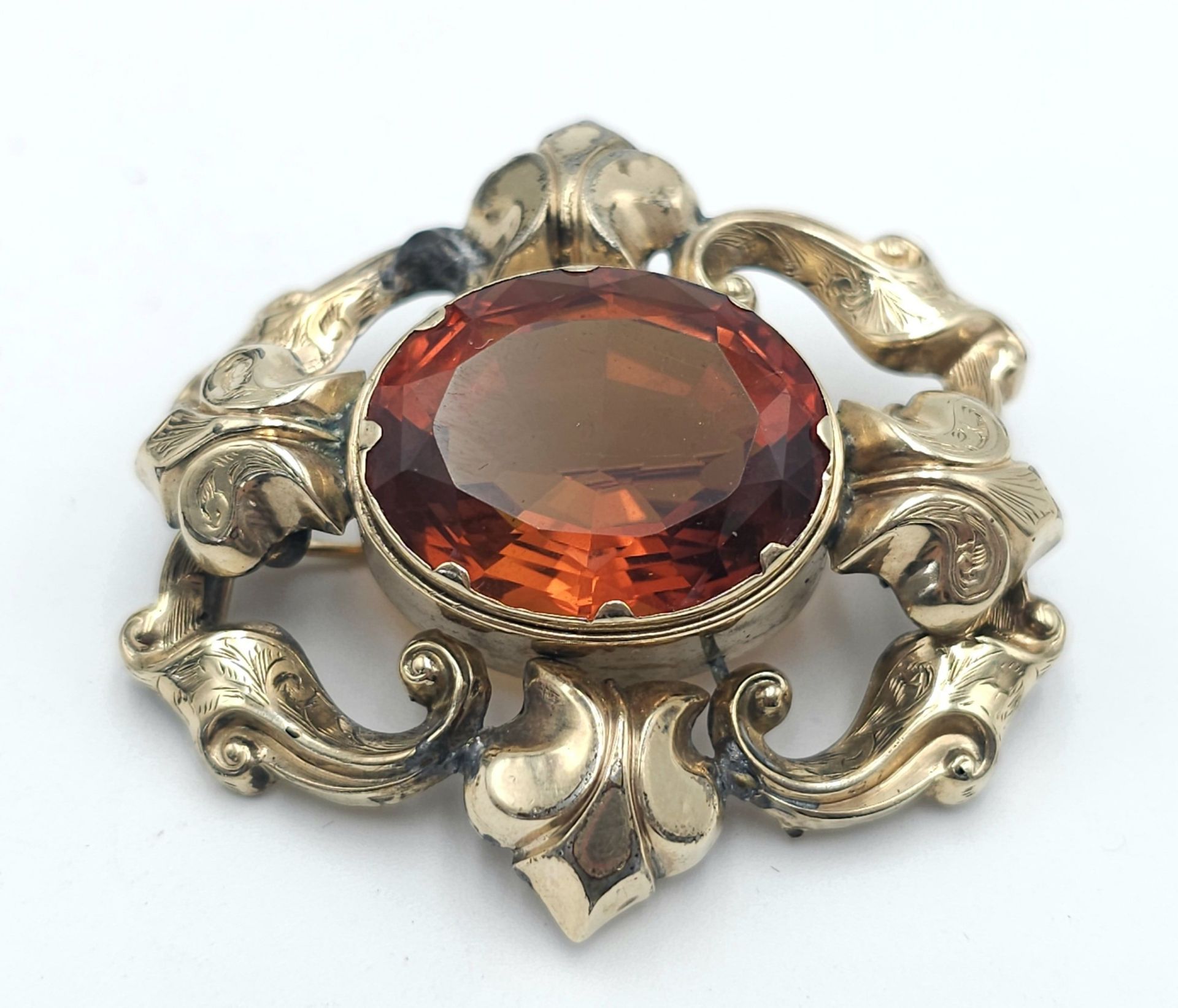 An Antique Large Citrine Brooch - Set in yellow metal. 5cm