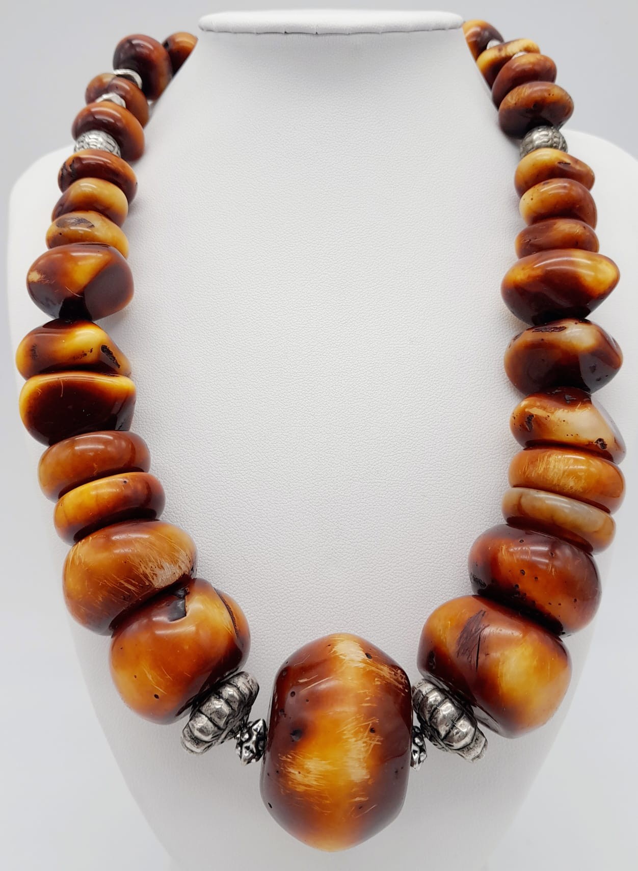 A Berber Resin Amber Necklace. 48cm length. 925 silver clasp.