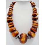 A Berber Resin Amber Necklace. 48cm length. 925 silver clasp.