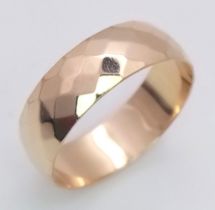 A 9K Yellow Gold Faceted Wedding Band. Size N 1/2. 2.7g total weight.