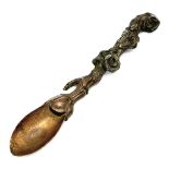 A rare antique, bronze, oriental (possibly Chinese), heavily ornate teaspoon. The handle has a