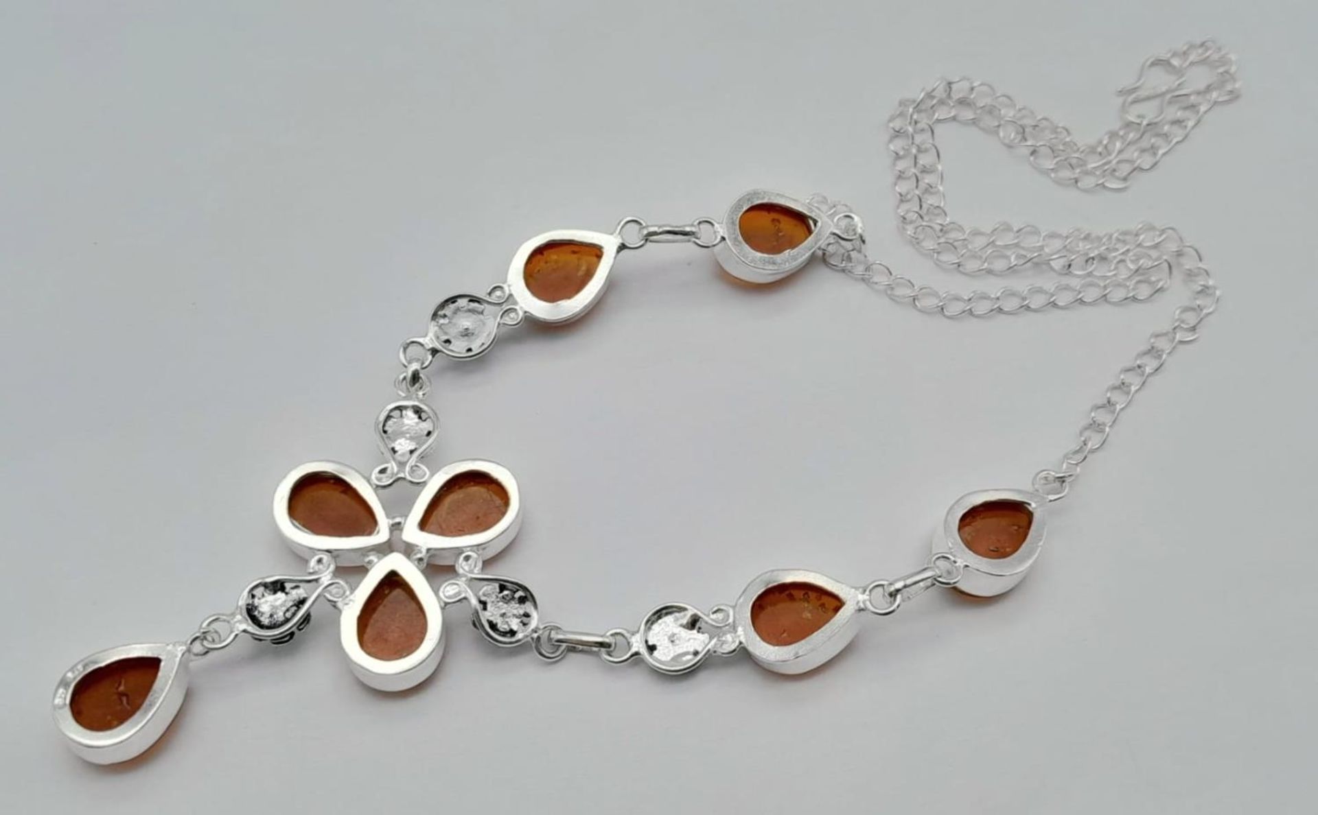 An Amber Resin Necklace set in 925 Silver. 50cm. - Image 2 of 4