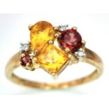 A 9K YELLOW GOLD DIAMOND AND MULTI-GEM SET RING. 2.2G. SIZE N