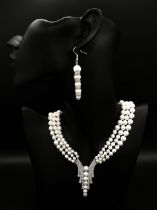 A magnificent necklace with three graduating rows of natural white mature pearls for the South Seas,