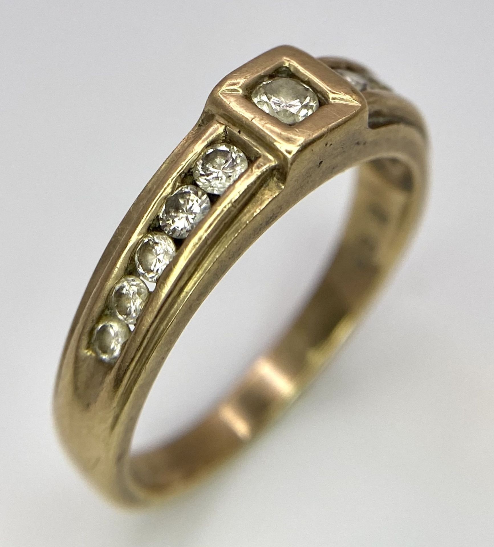 A Vintage 9K Yellow Gold Diamond Half-Eternity Ring. Belt buckle design. Size R. 3.7g total weight. - Image 2 of 6