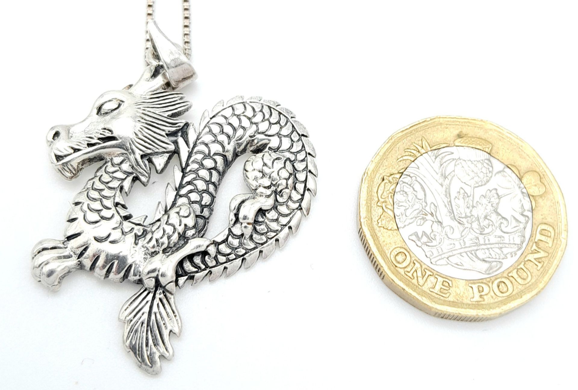 A Sterling Silver Dragon Pendant on 925 Silver Chain. 4.5cm pendant, 62cm chain. 9.7g total weight. - Bild 2 aus 5