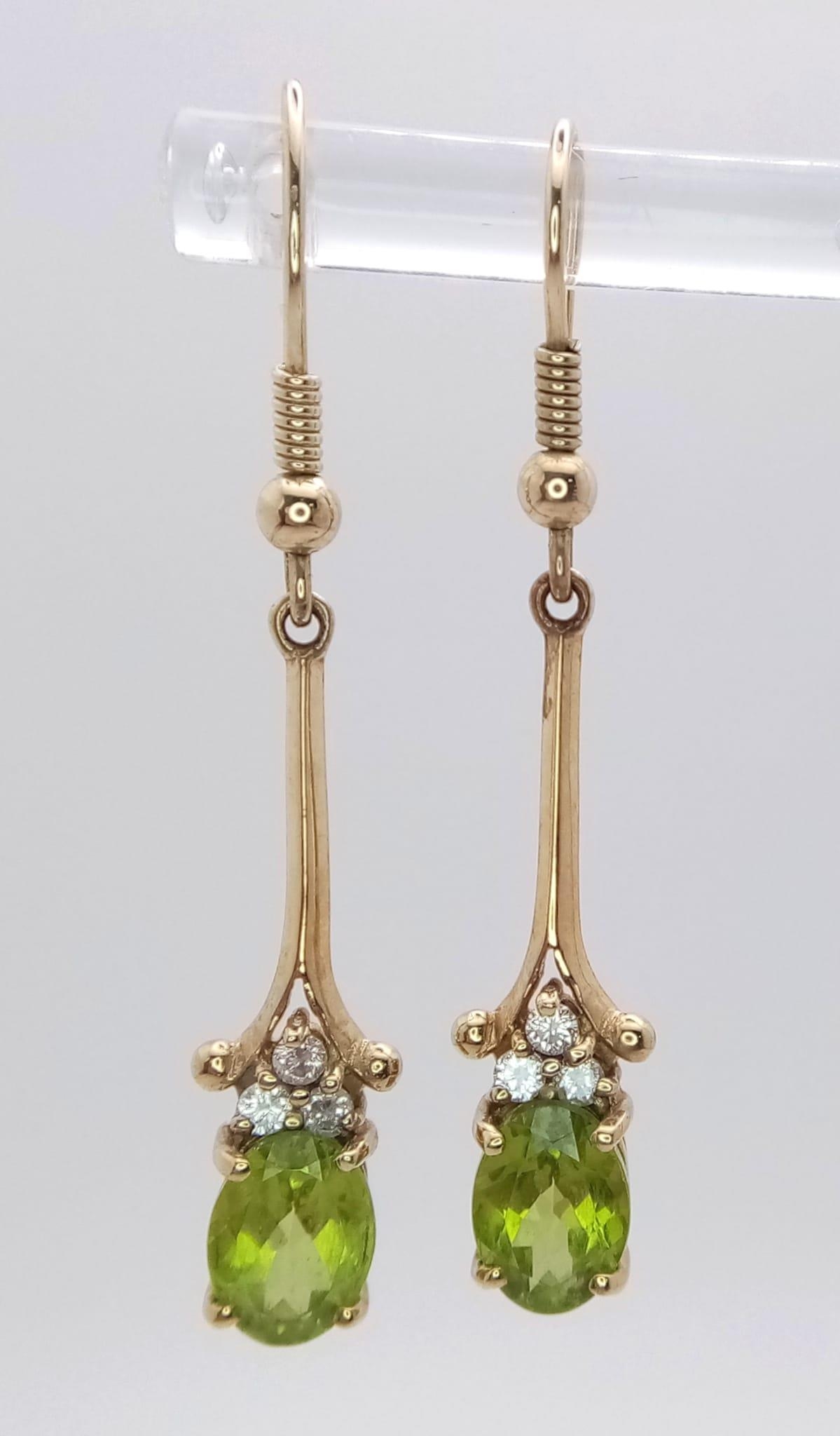 A 9K Yellow Gold, Peridot Drop Earring and Pendant Set. Both decorated with seed pearls. Pendant - - Image 5 of 7