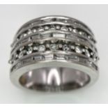 AN 18K WHITE GOLD 5 ROW DIAMOND RING. MIXTURE OF ROUND BRILLIANT CUTS AND BAGUETTE CUT DIAMONDS.