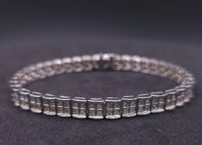 A 9K White Gold Diamond Set Bracelet, with Under Safety Catch Fitting. 1ctw, 19cm length, 12.7g