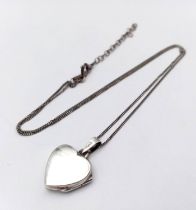 A 925 silver heart locket pendant on silver chain. Total weight 4.2G. Total length 46cm.