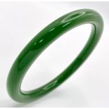 A Spinach Green Chinese Thin Jade Bangle. 7mm width. 60mm inner diameter.