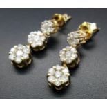 A Pair of 14K Yellow Gold and Diamond Drop Earrings. A total of 42 round cut diamonds - 1ctw. H-I in