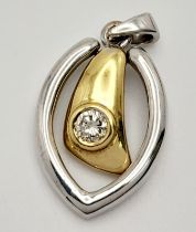A 18K two-colour diamond articulated pendant 5.1g, 0.25ct diamond, approx 26mm x 14mm. ref: SH2757H