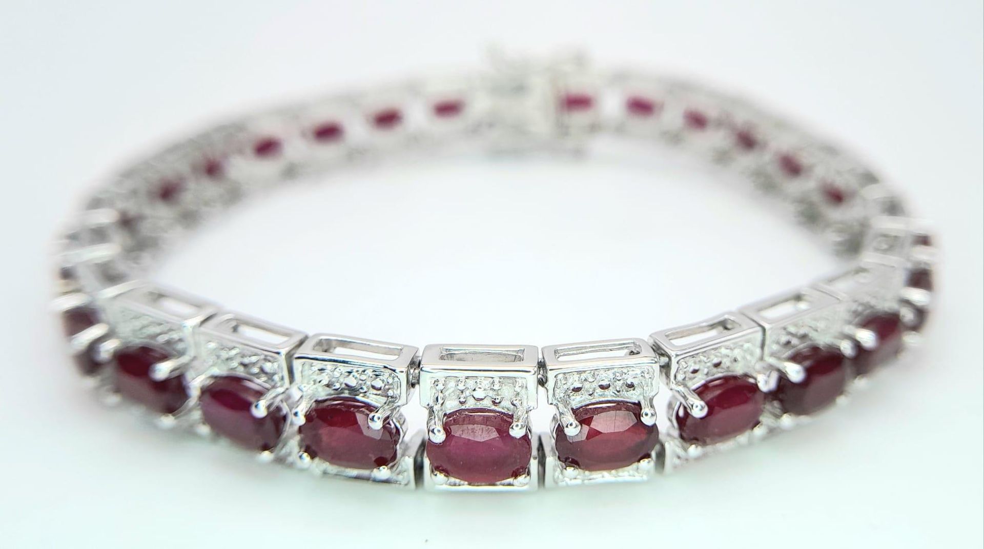 An Exquisite Hallmarked 2018 Sterling Silver 28 Oval Cut Ruby Set Bracelet. Each Ruby Measures 5mm - Image 2 of 6