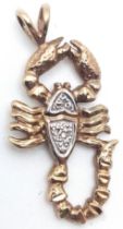 A 9K YELLOW GOLD DIAMOND SET SCORPION CHARM. 2.8cm length, 2.1g total weight. Ref: SC 8009