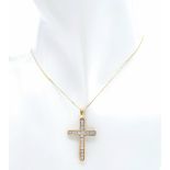 A 10K yellow gold diamond set cross pendant set on 16" 9K yellow gold fine curb chain, 2.4g total