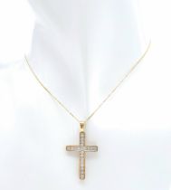 A 10K yellow gold diamond set cross pendant set on 16" 9K yellow gold fine curb chain, 2.4g total