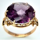 An 18K Gold Alexandrite Ring. Large 6ct faceted alexandrite. Size M. 5.3g total weight.