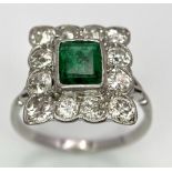 AN 18K WHITE GOLD (TESTED) EDWARDIAN OLD CUT DIAMOND AND EMERALD CLUSTER RING. 1.20CT OF OLD CUT