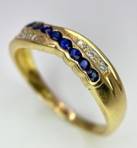 AN 18K YELLOW GOLD DIAMOND & BLUE STONE (PROBABLY SAPPHIRE) CROSSOVER RING. Size O, 2.7g total