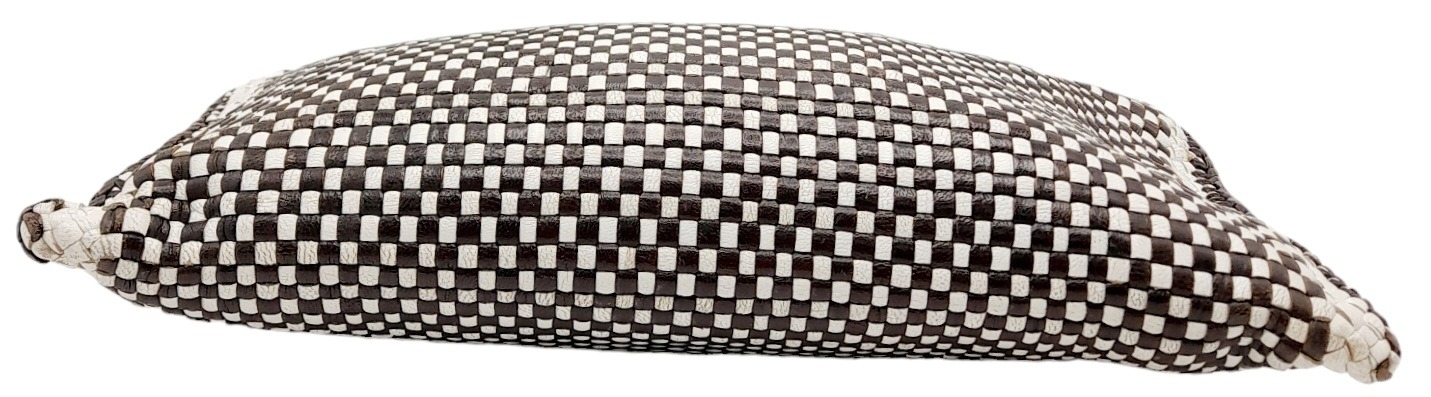 A Prada Black and White 'Madras' Clutch Bag. Woven leather exterior with gold-toned hardware and - Image 4 of 9