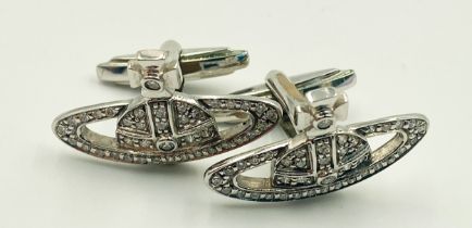 A PAIR OF 18K WHITE GOLD (STAMPED & TESTED) DIAMOND SET VIVIENNE WESTWOOD CUFFLINKS. 2.5cm length,