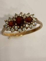 Stunning 9 carat GOLD and GARNET TRILOGY RING. Having 3 x oval and round cut Garnets set to top.