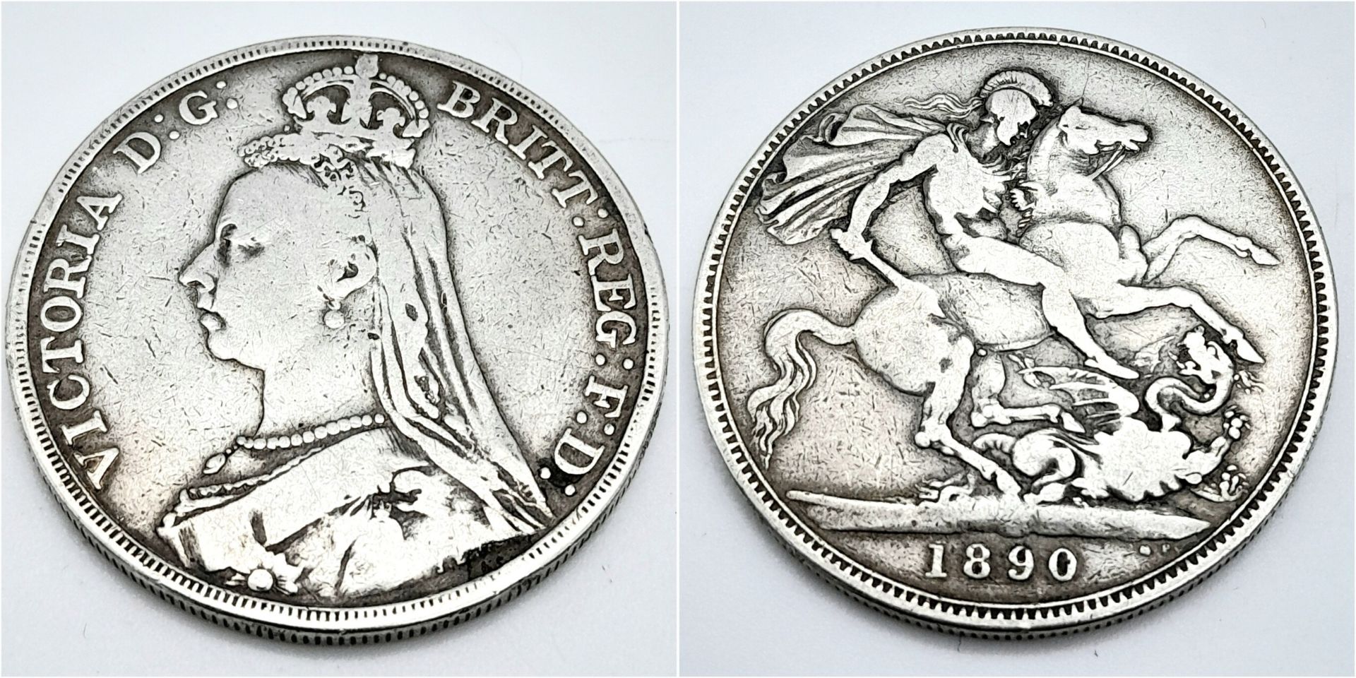 An 1890 Queen Victoria Silver Crown Coin. VF grade but please see photos.