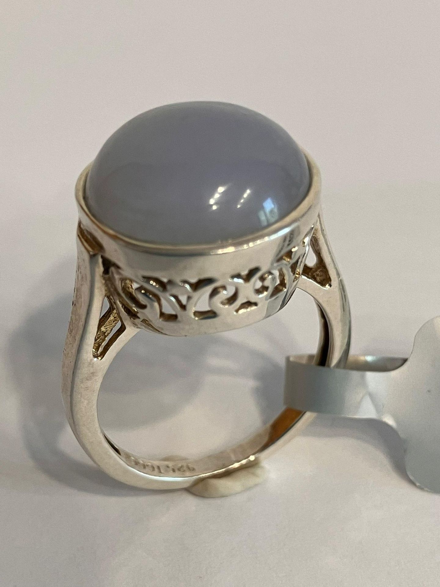 SILVER and MOONSTONE CABACHON RING. Consisting a large circular Moonstone set in a Beautiful Pierced