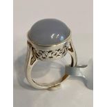 SILVER and MOONSTONE CABACHON RING. Consisting a large circular Moonstone set in a Beautiful Pierced