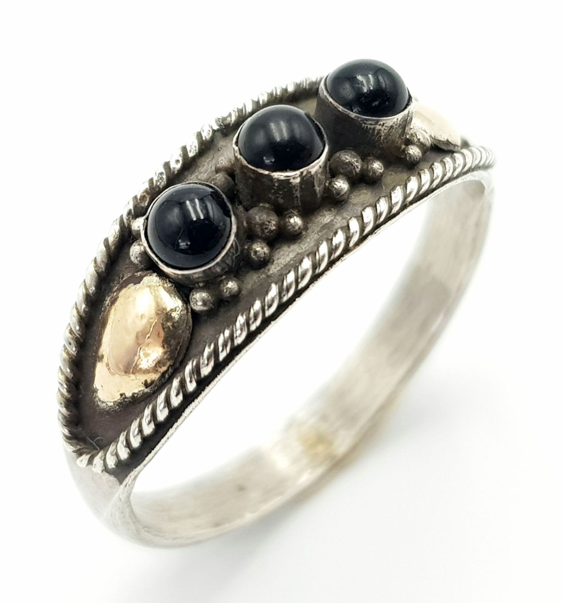 A Vintage or Older, Gold on Sterling Silver, Black Onyx Cabachon Set Ring. Size O. Measures 7mm Wide