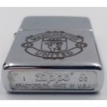 A Manchester United Zippo Lighter Box Set with Tool and Empty Lighter Fluid Can. UK MAINLAND SALES