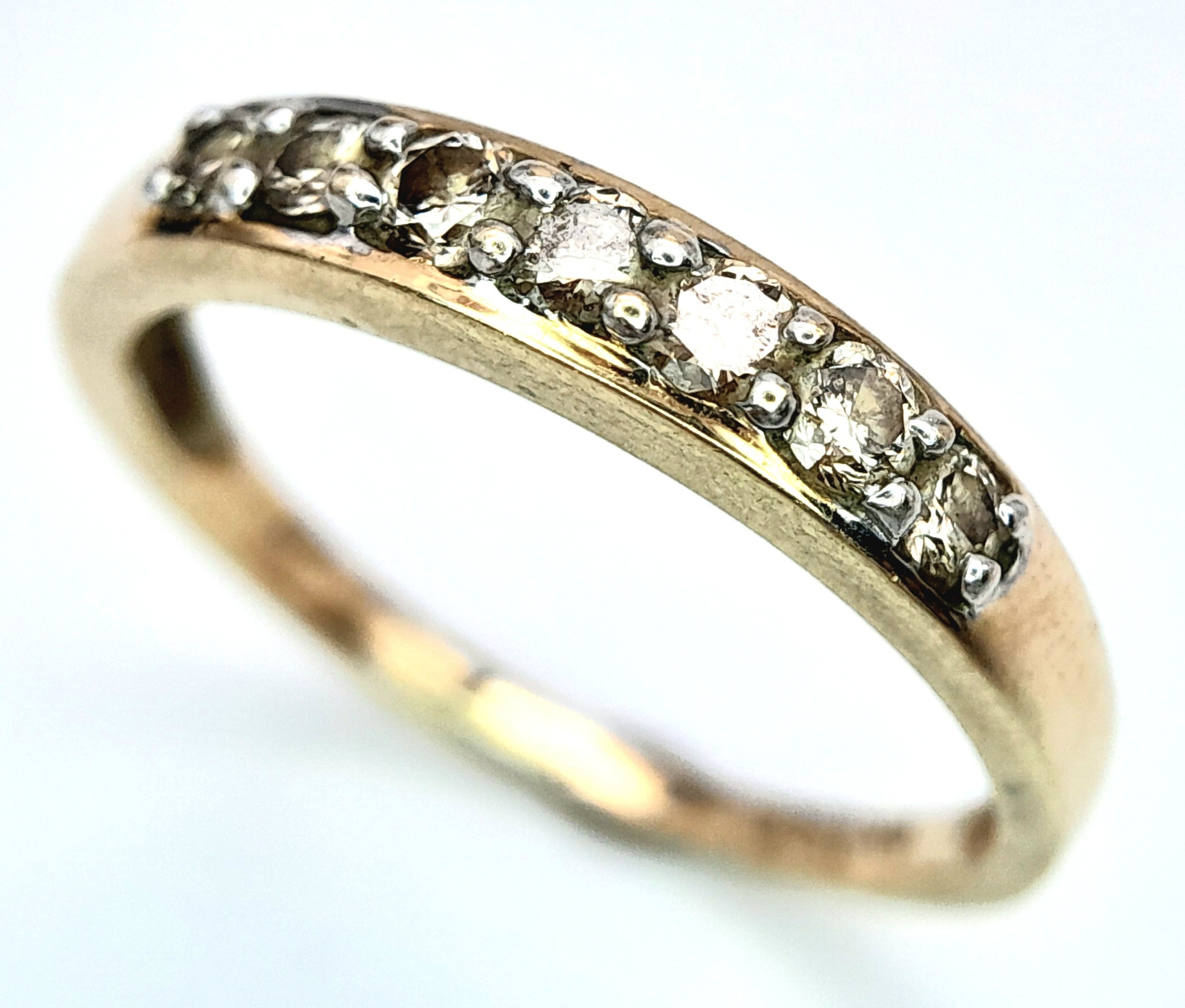 A 9K YELLOW GOLD DIAMOND SET BAND RING. 0.25ctw, Size N, 1.8g total weight. Ref: SC 8007 - Image 2 of 6