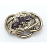 An Antique Garnet Twisted Yellow Metal Brooch. 4.5cm.