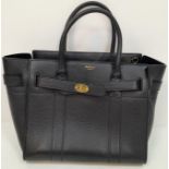 A Mulberry Bayswater Leather Handbag. Textured black leather exterior with gold tone hardware.