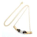 A 9 Carat Yellow Gold Diamond and Sapphire Set Necklace. 45 cm Length. Set with a Centre Round Cut