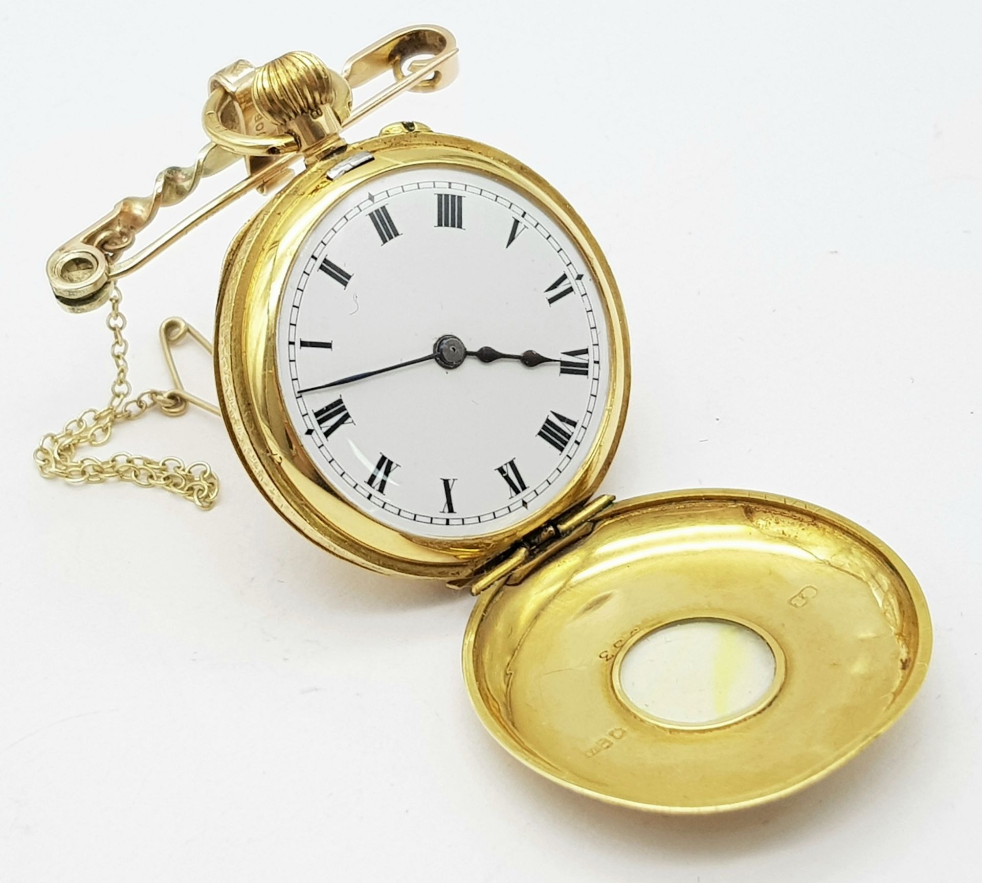 A Vintage 18K Gold Miniature Pocket Watch. A beautifully engraved half-hunter design. Top winder.