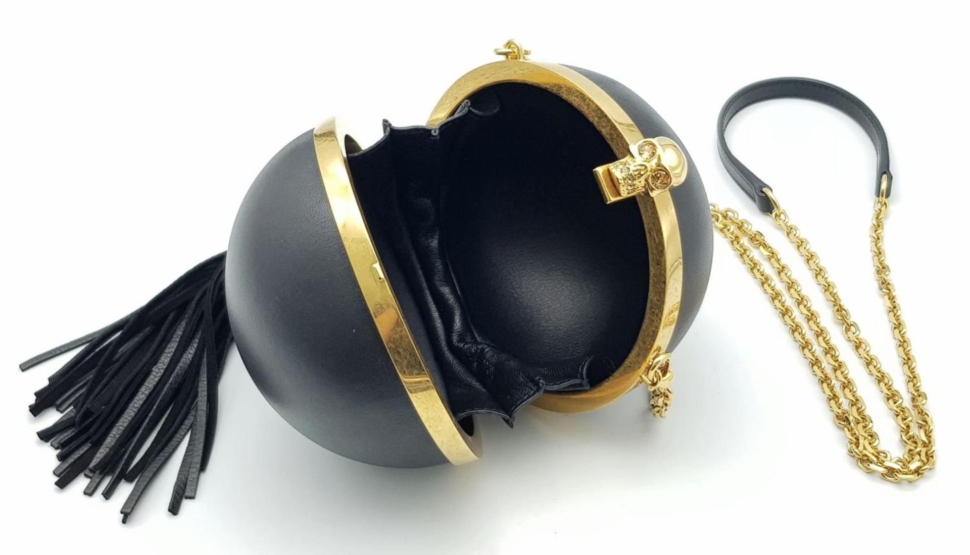 An Alexander Mcqueen Skull Ball Clutch Bag. Black leather exterior with gold tone hardware. - Image 3 of 6
