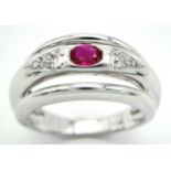 AN 18K WHITE GOLD DIAMOND & RUBY RING. Size N, 6.6g total weight. Ref: SC 8068