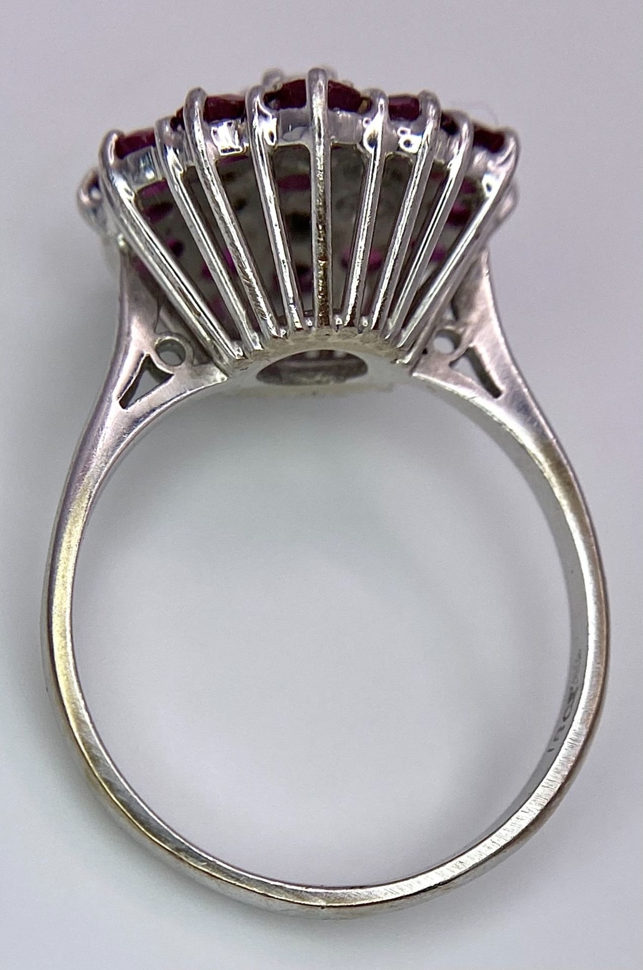 A Gorgeous 18K White Gold, Ruby and Diamond Ring. Floral design on an elevated setting. 14 rubies - Image 3 of 6