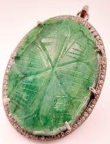 A Silver Carved Emerald Pendant with Rose-Cut Diamond Surround. Oval shaped. 144.25- ctw. Diamonds -