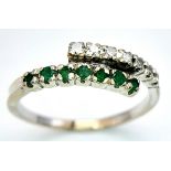 A 14K WHITE GOLD DIAMOND & EMERALD 2 ROW CROSSOVER RING. Size L, 1.6g total weight. Ref: SC 8077